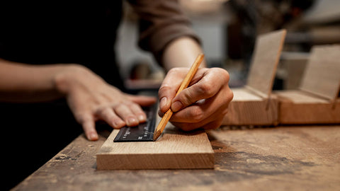 female-carpenter-working-studio-with-pencil